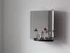 124° wall mirror by Daniel Rybakken for Artek featuring sculptural dual-aspect design in polished steel construction