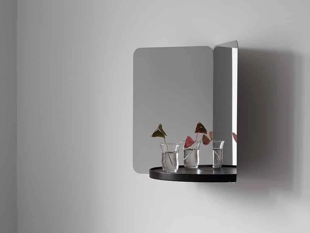 124° wall mirror by Daniel Rybakken for Artek featuring sculptural dual-aspect design in polished steel construction
