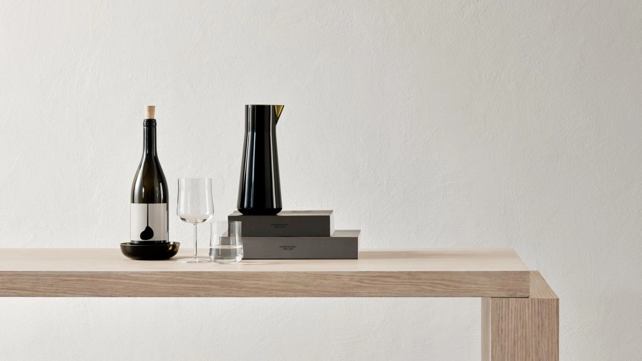 Informal glass collection by Björn Dahlström showing wine glasses and carafe for Orrefors Swedish design