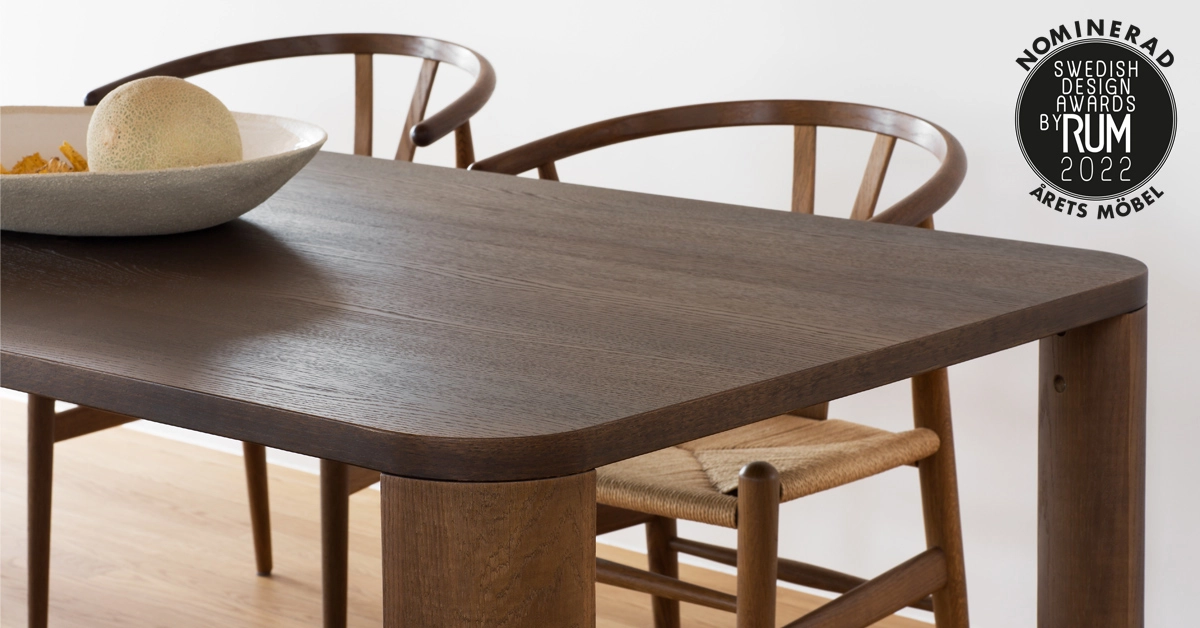 Moci dining table by Moa Sjöberg showing solid oak legs and elegant rounded edges for Asplund Sweden
