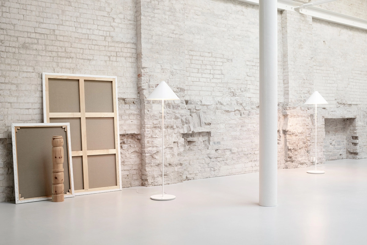 Keglen floor lamp by BIG Ideas showing conical aluminum shade with organic glass diffuser for Louis Poulsen