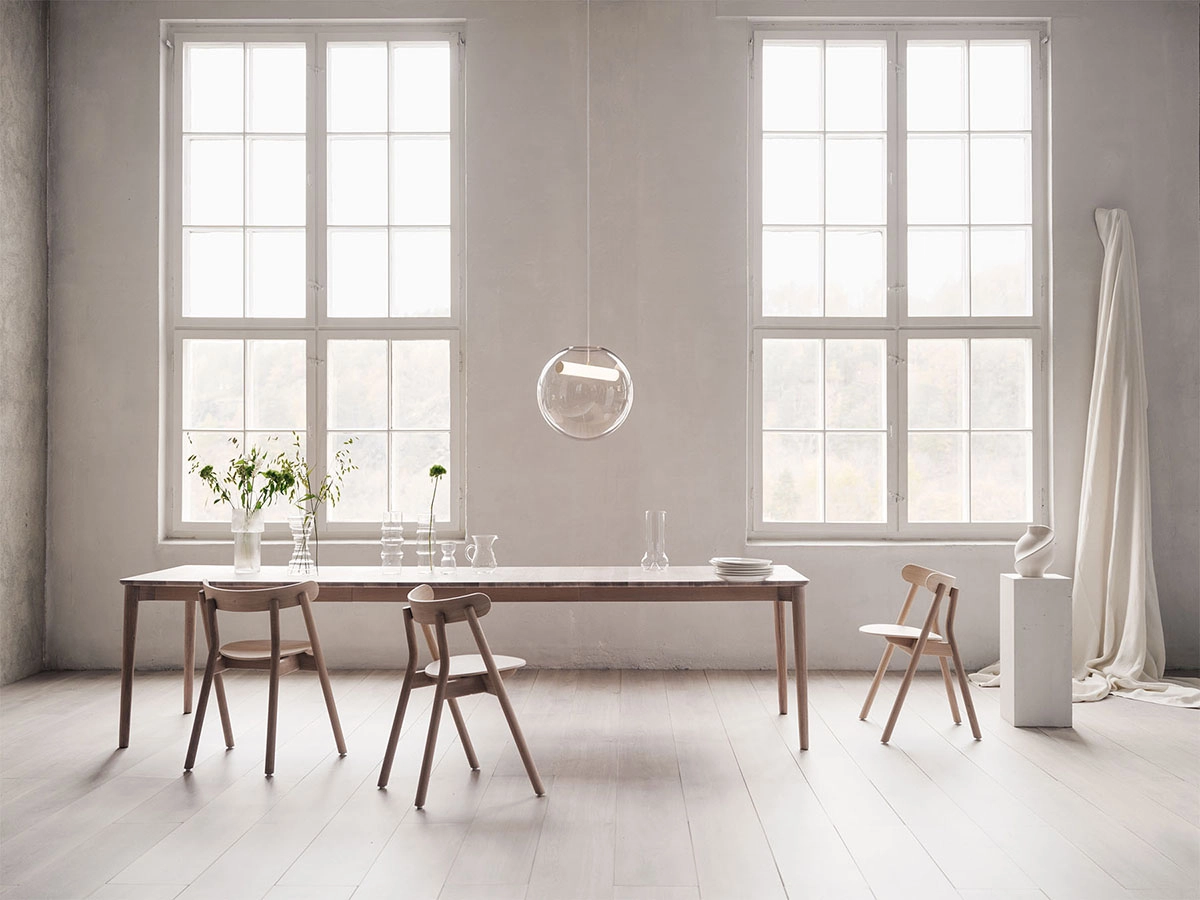 Expand dining table by Sami Kallio for Northern featuring solid oak construction and smooth extension system