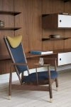 Finn Juhl Whisky Chair relaunch featuring extravagant 1948 design with brass tray and mouth-blown glass