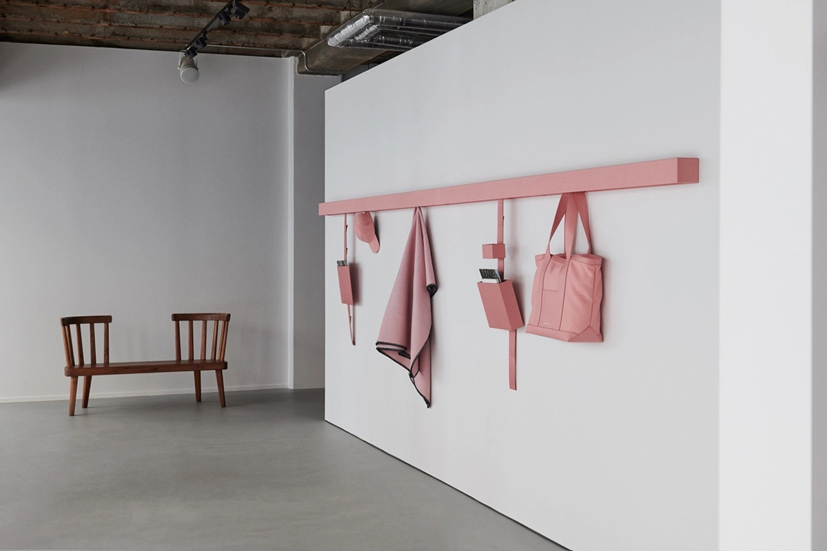 Kvadrat Raf Simons Shaker System horizontal bar with accessories demonstrating minimalist storage design