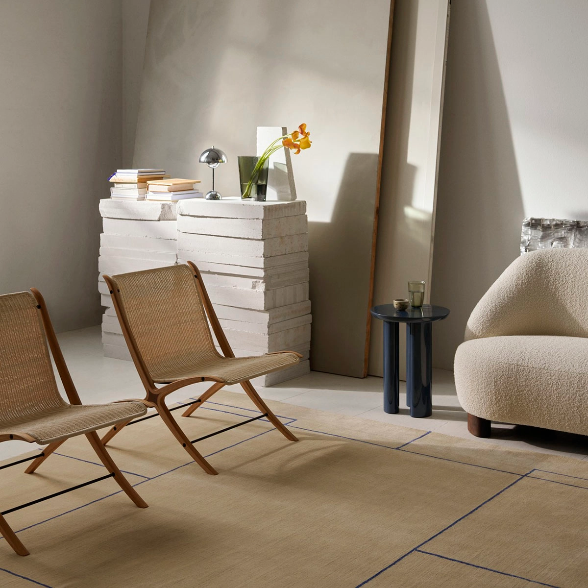 &tradition X lounge chair by Hvidt & Mølgaard featuring laminated oak frame and natural rattan seat