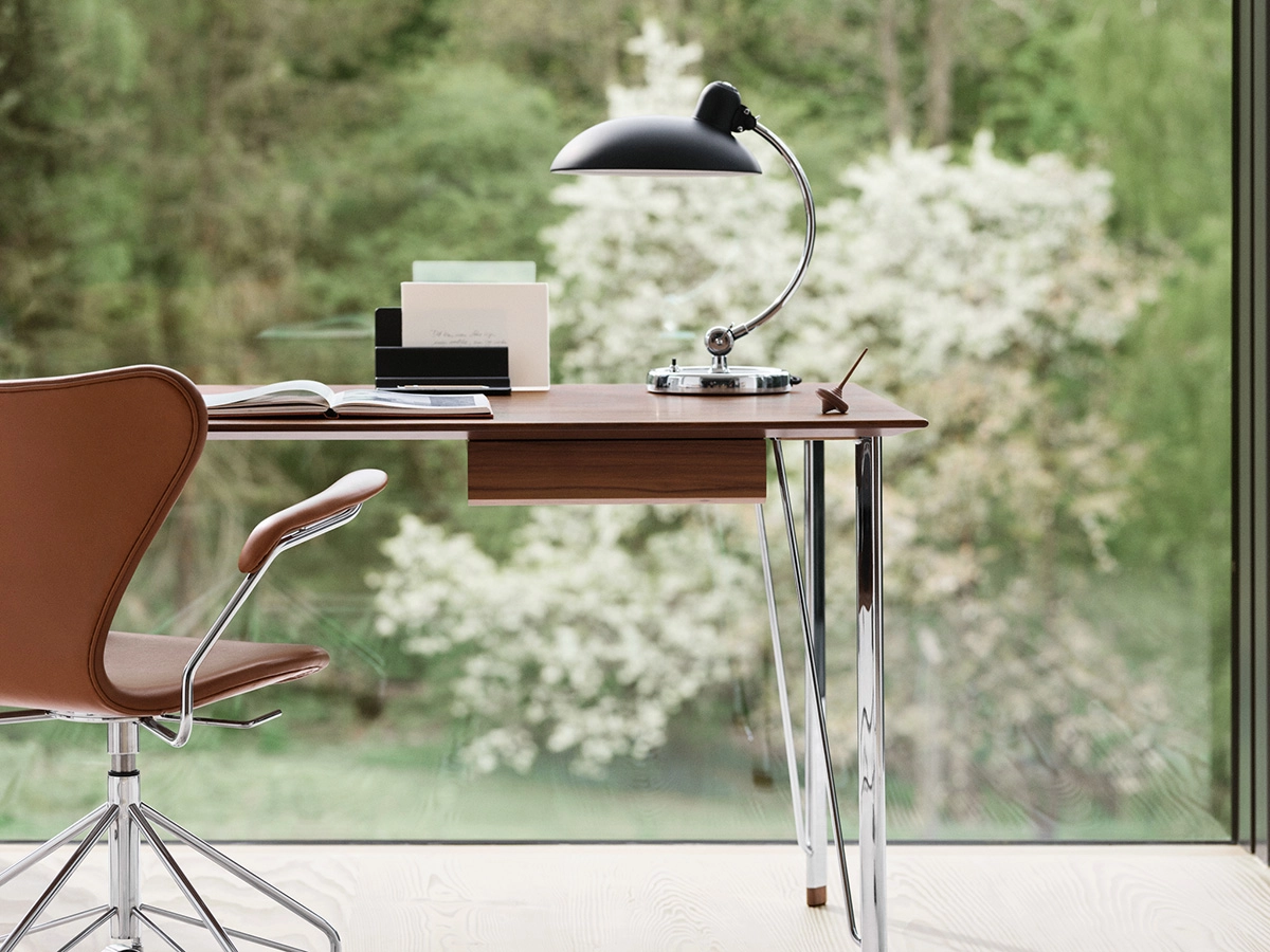 Fritz Hansen FH3605 by Arne Jacobsen featuring distinctive steel tube legs and walnut veneer tabletop