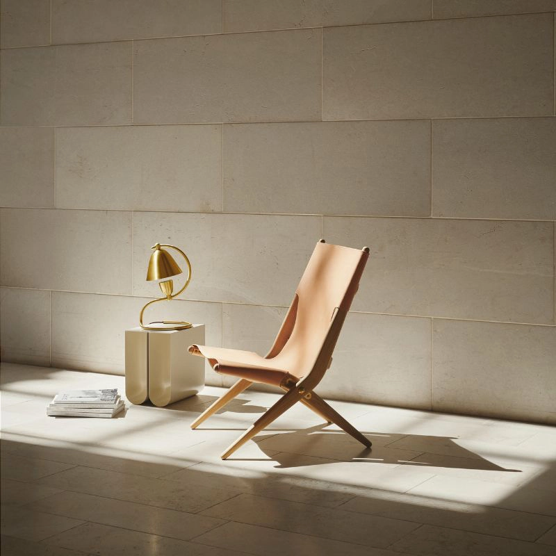 Klampenborg table lamp by Mogens Lassen featuring geometric brass design with integrated dimmer function