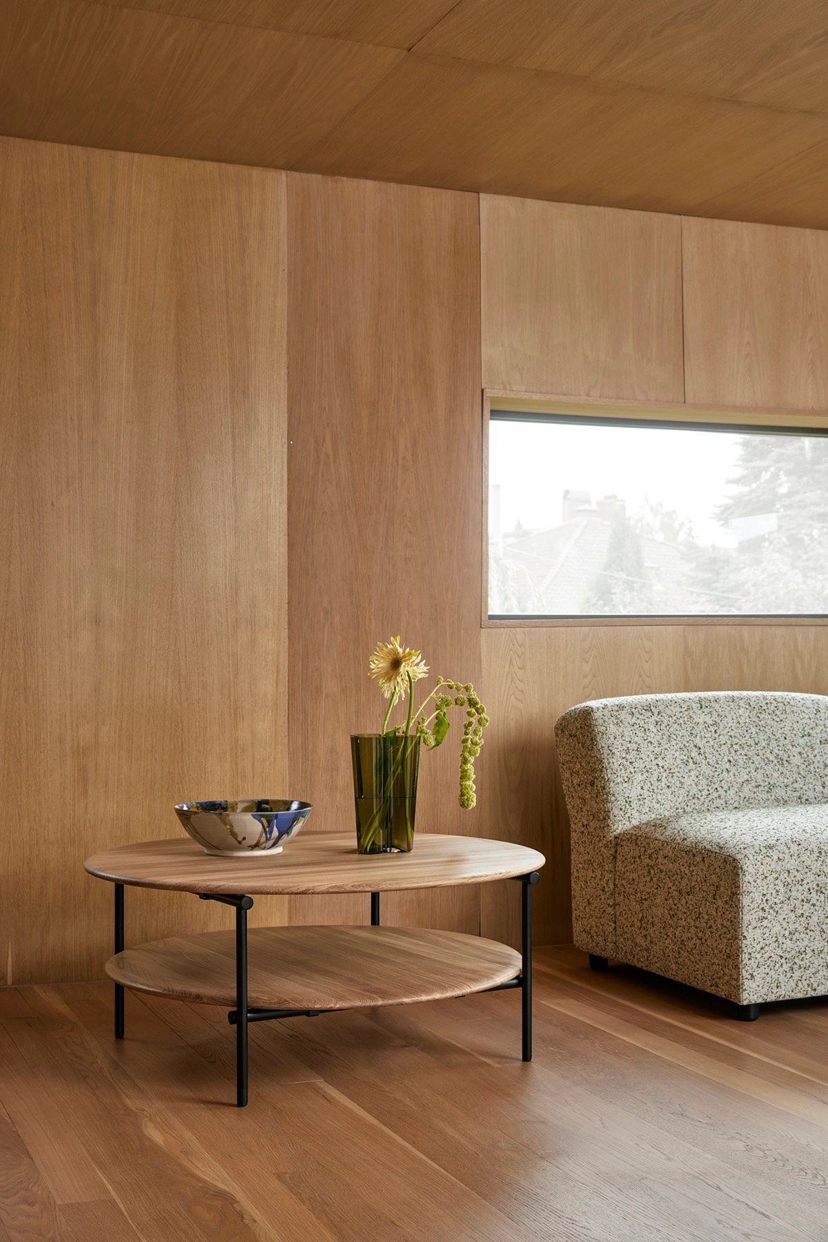 Mio occasional table by Takagi Homstvedt featuring circular oak top and lapped steel framework design
