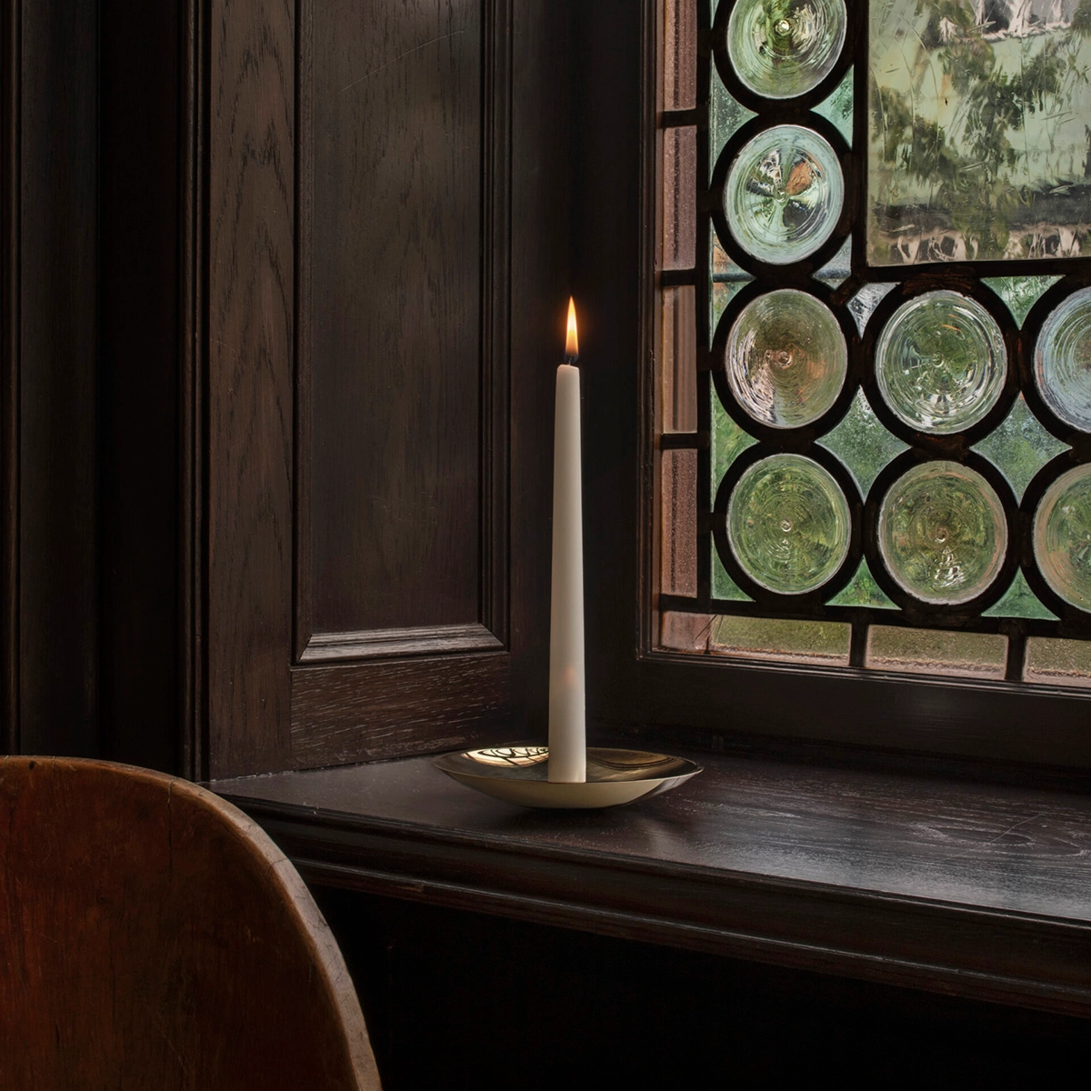Holocene No. 6 brass candleholder by Ilse Crawford featuring concave disc design with central spike