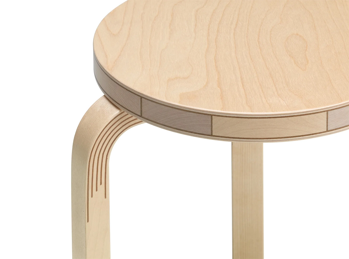 Close-up of Aalto L-leg construction showing bent birch wood and veneer insertion technique