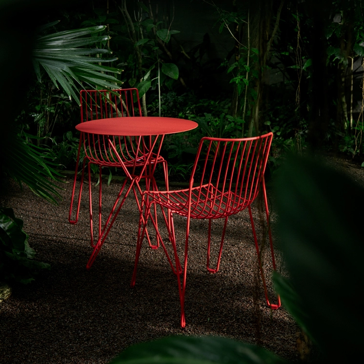 Tio Collection featuring new bold color option on wire chairs and tables designed by Chris Martin for Massproductions