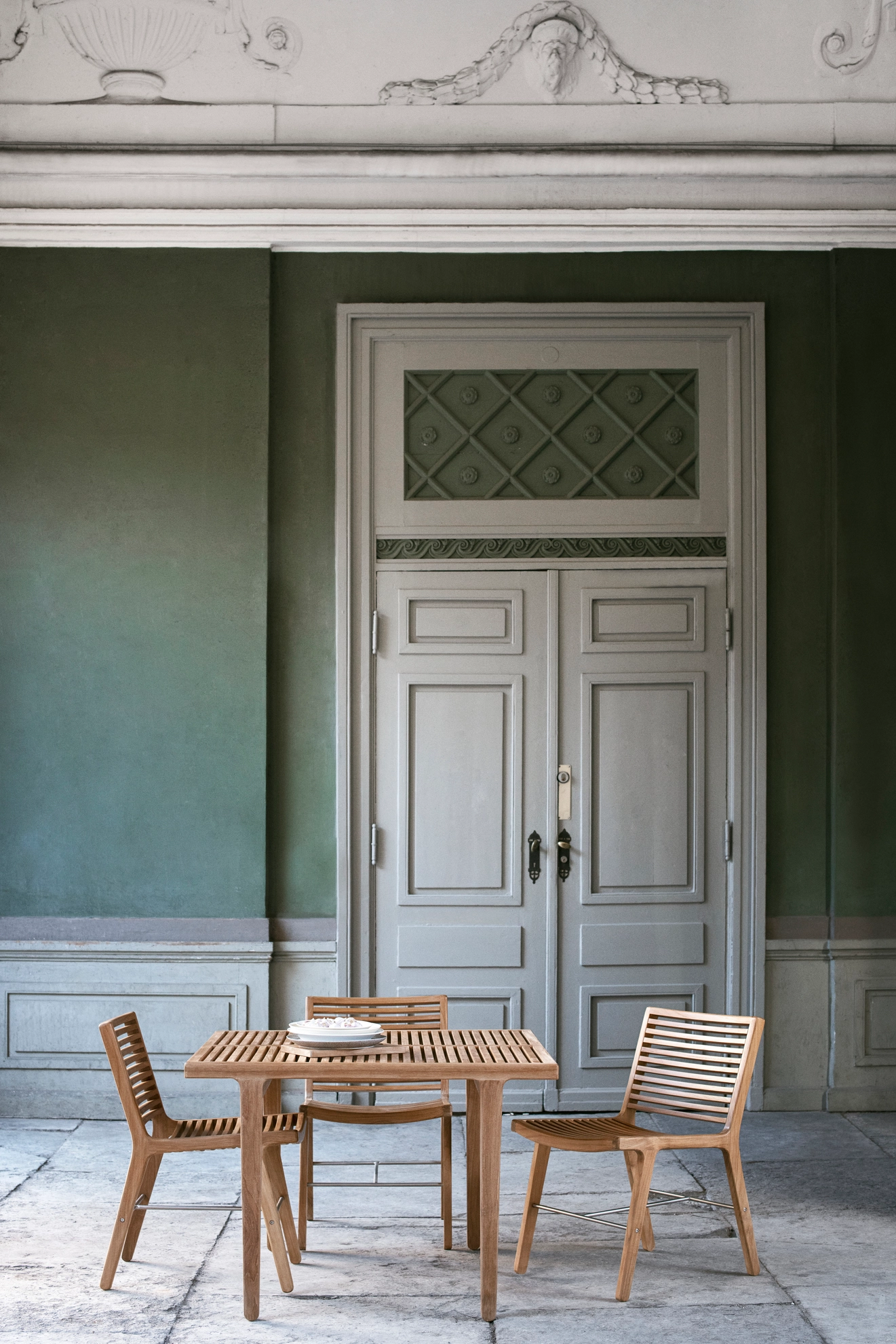 Morten Anker's Rib Outdoor Collection for Sibast Furniture featuring sleek wooden slats and contemporary Danish design for outdoor spaces.