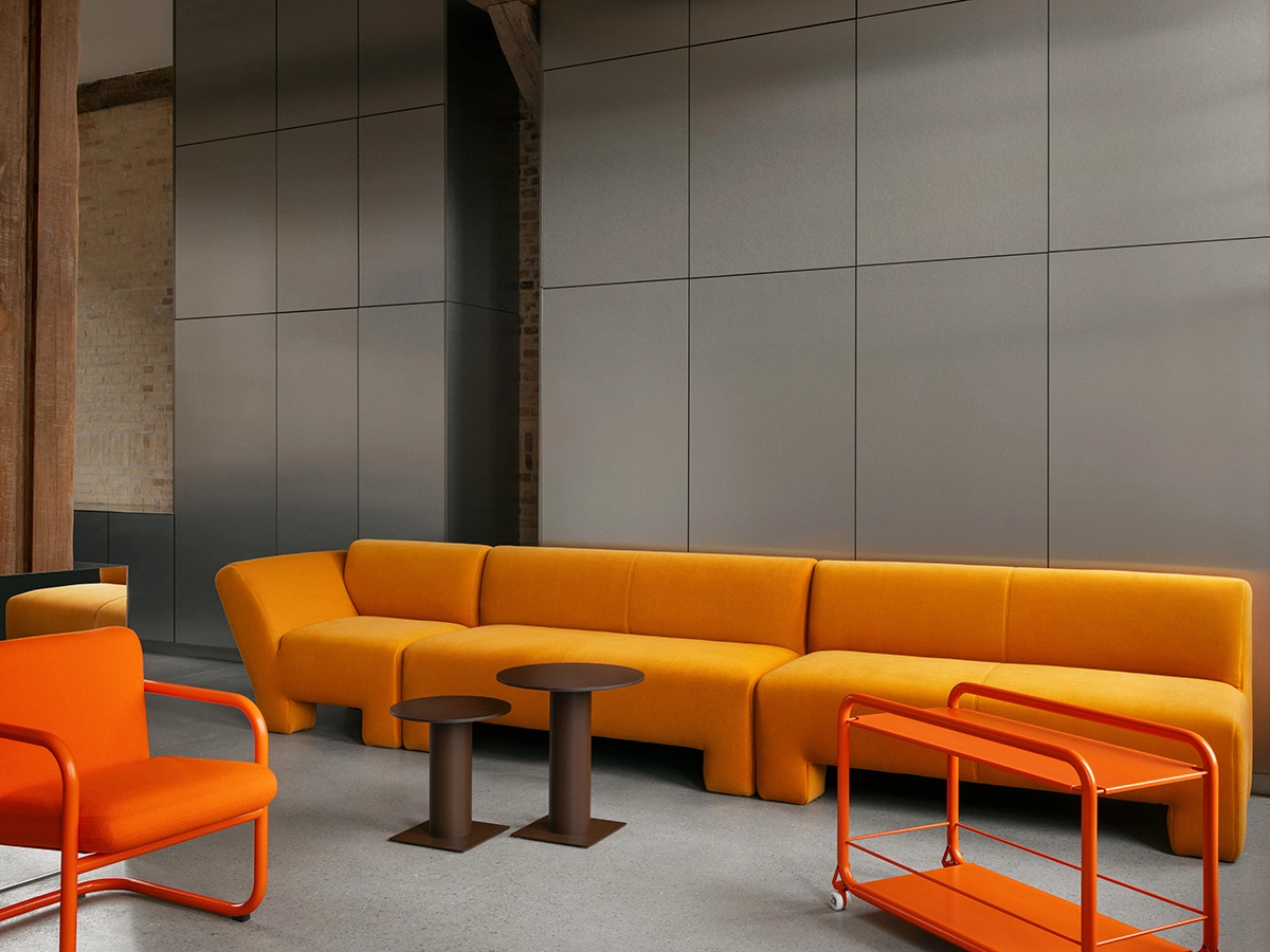 Lammhults crafts minimalist furniture with precise metal detailing, embodying Swedish modernism through clean lines and functional design.