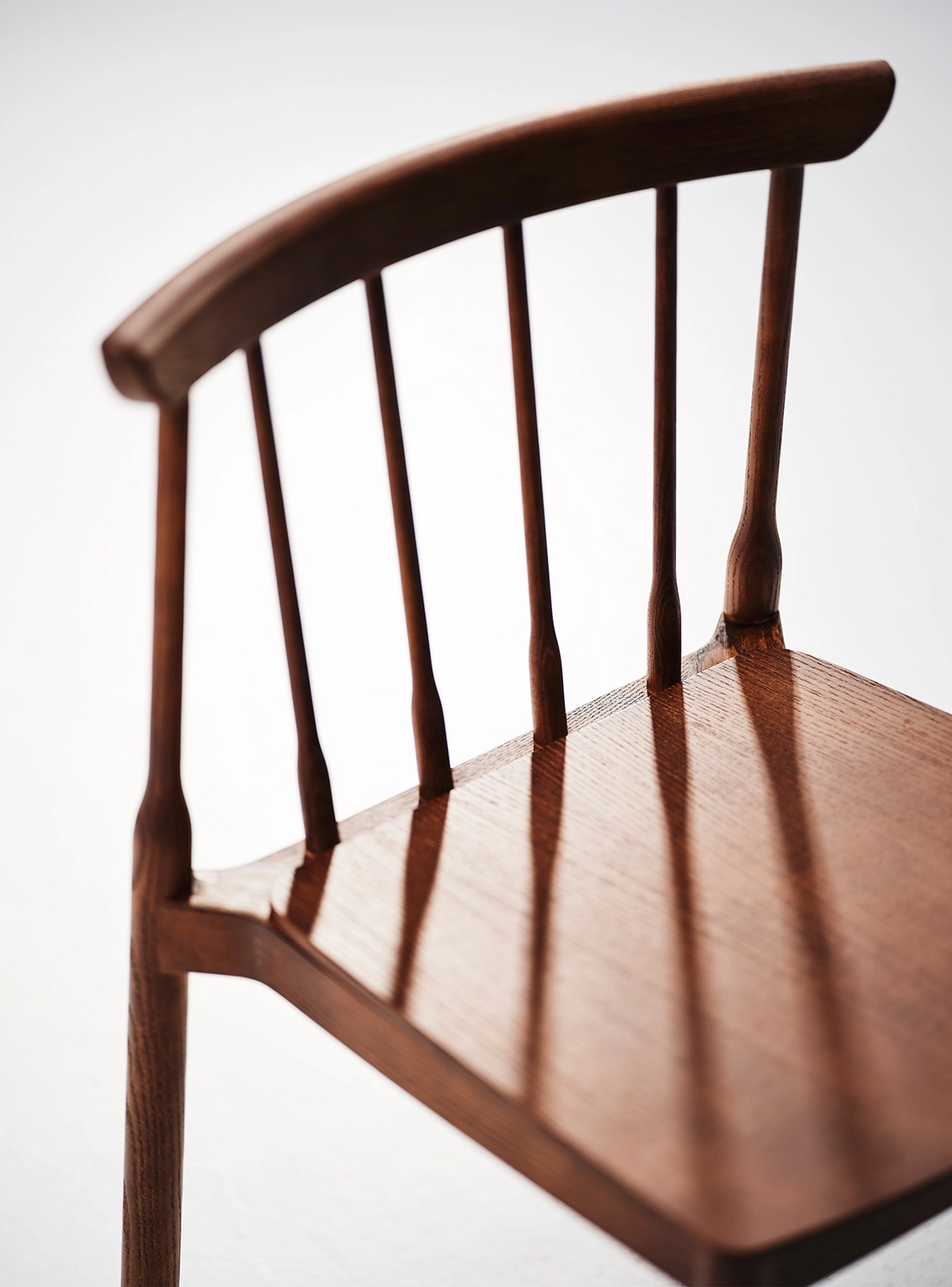 Stackable Taverna peg chair by Sami Kallio featuring classic construction with modern design elements