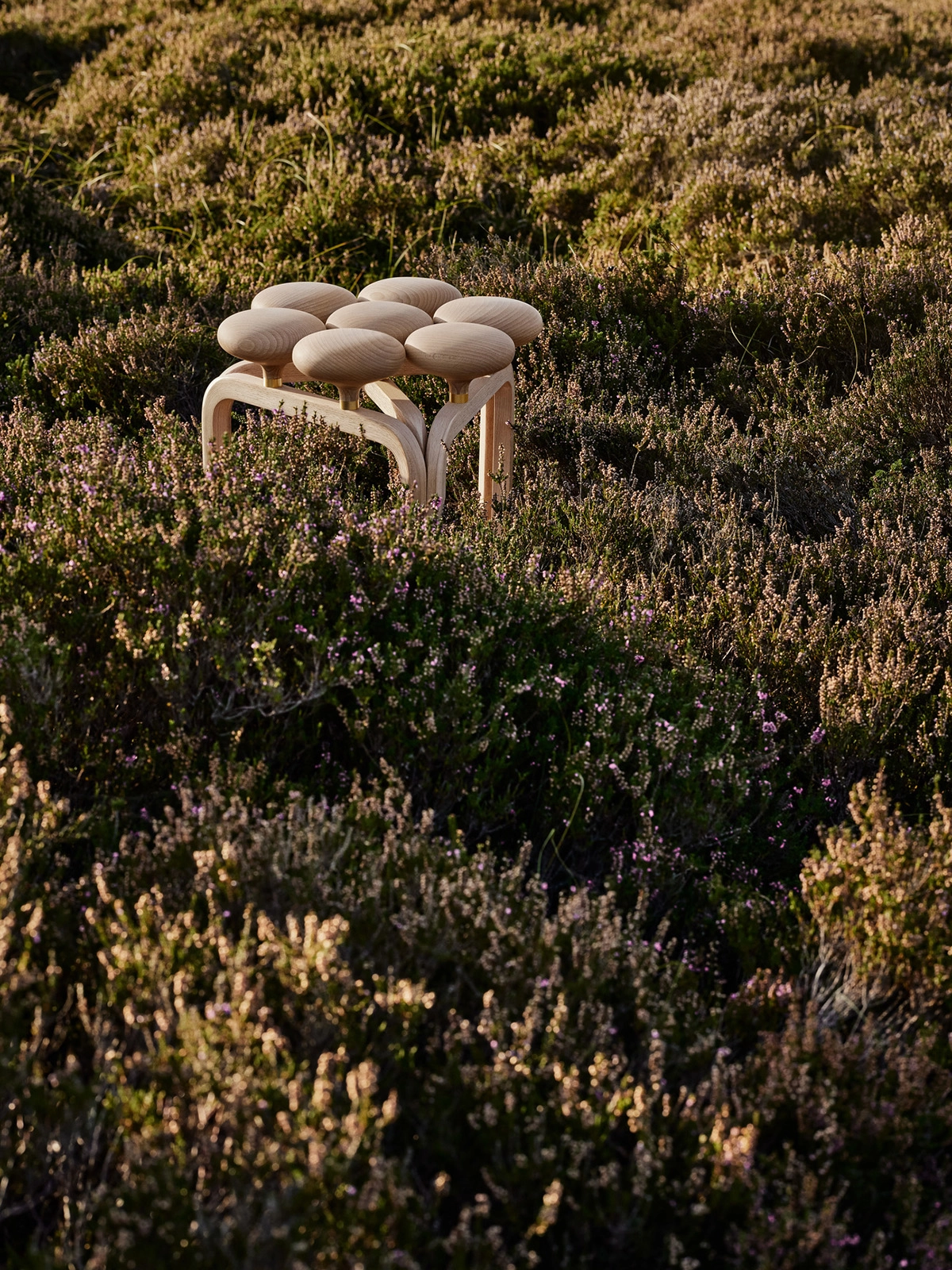 Playful Utzon Stool by architect Jørn Utzon featuring expressive organic design for Fritz Hansen