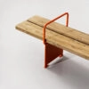 Close-up of Briskeby bench's new armrest connection showing Vestre's weather-resistant materials and engineering.