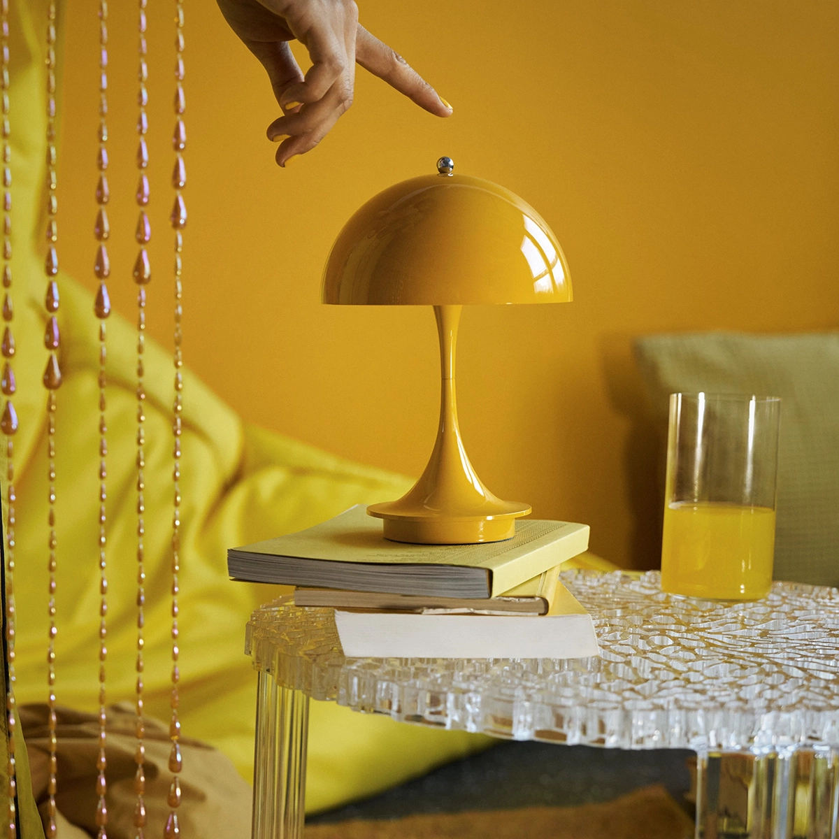 PANTHELLA portable lamp by Verner Panton now available in stunning yellow finish bringing vibrant portable illumination option