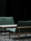 Japan Sofa by Finn Juhl featuring minimalist wooden frame with horizontal backrest and clean upholstered seating in contemporary setting.