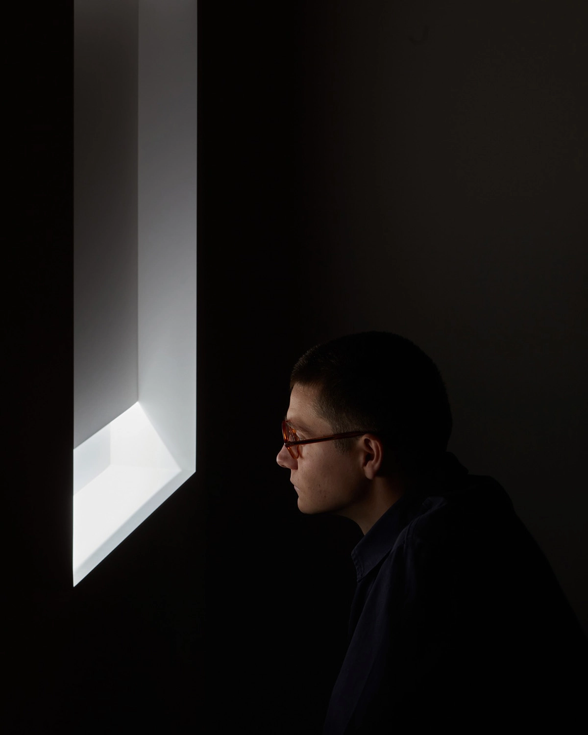Designer Daniel Rybakken adjusting Daylight lamp settings at Vibia's Milan exhibition