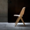 Lavitta chair in light wood finish showing rounded corners and tapered legs against minimal background