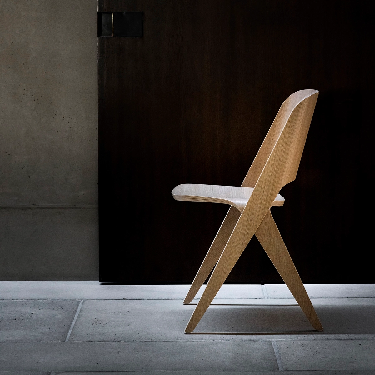 Lavitta chair in light wood finish showing rounded corners and tapered legs against minimal background