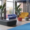 Two-seater Radar Sofa with high privacy backrest creating an intimate alcove within open lounge space