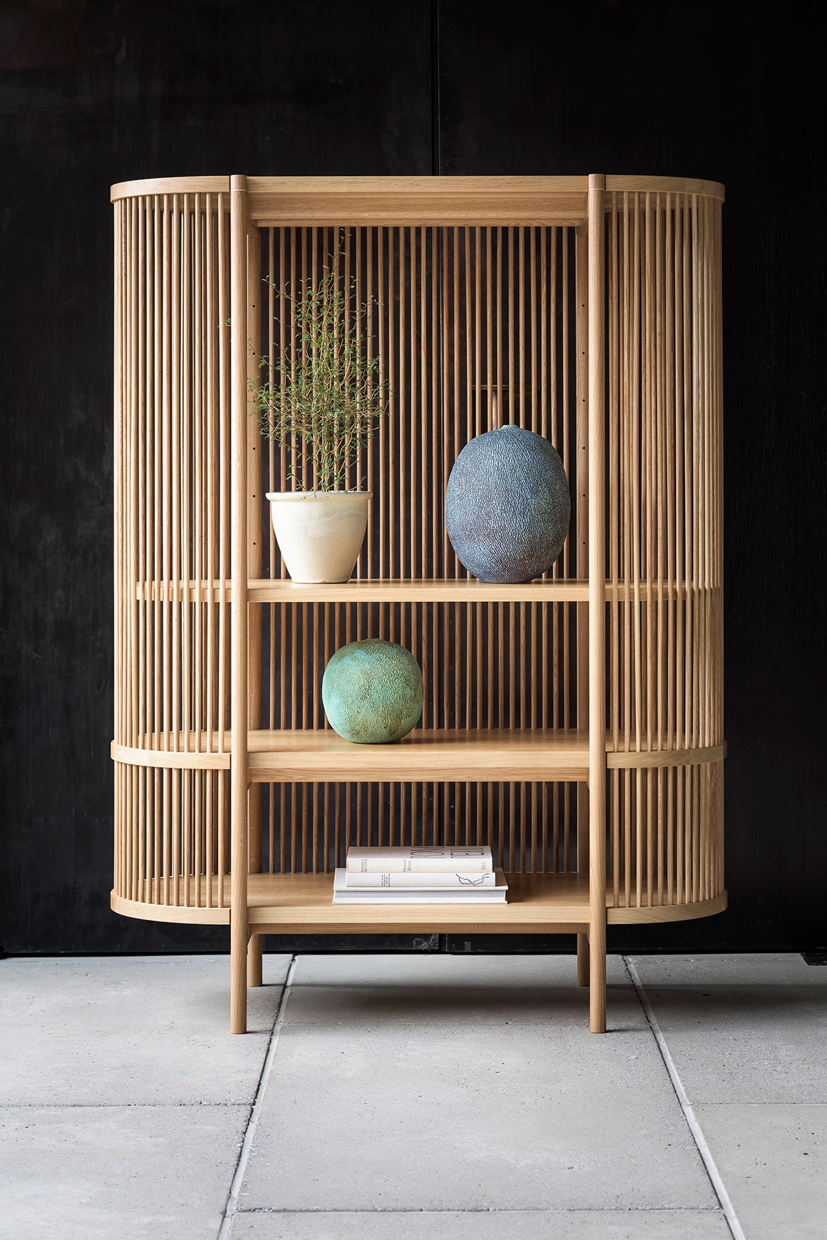 Bastone cabinet by Antrei Hartikainen featuring rhythmic wooden dowels, now part of Nikari's collection