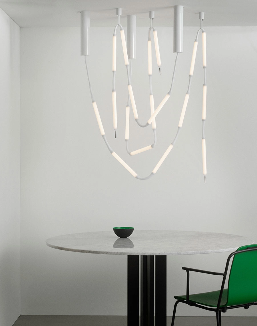 Normann Copenhagen's lighting collection featuring various configurations of the Reb Lamp designed by Verena Hennig alongside other pieces.