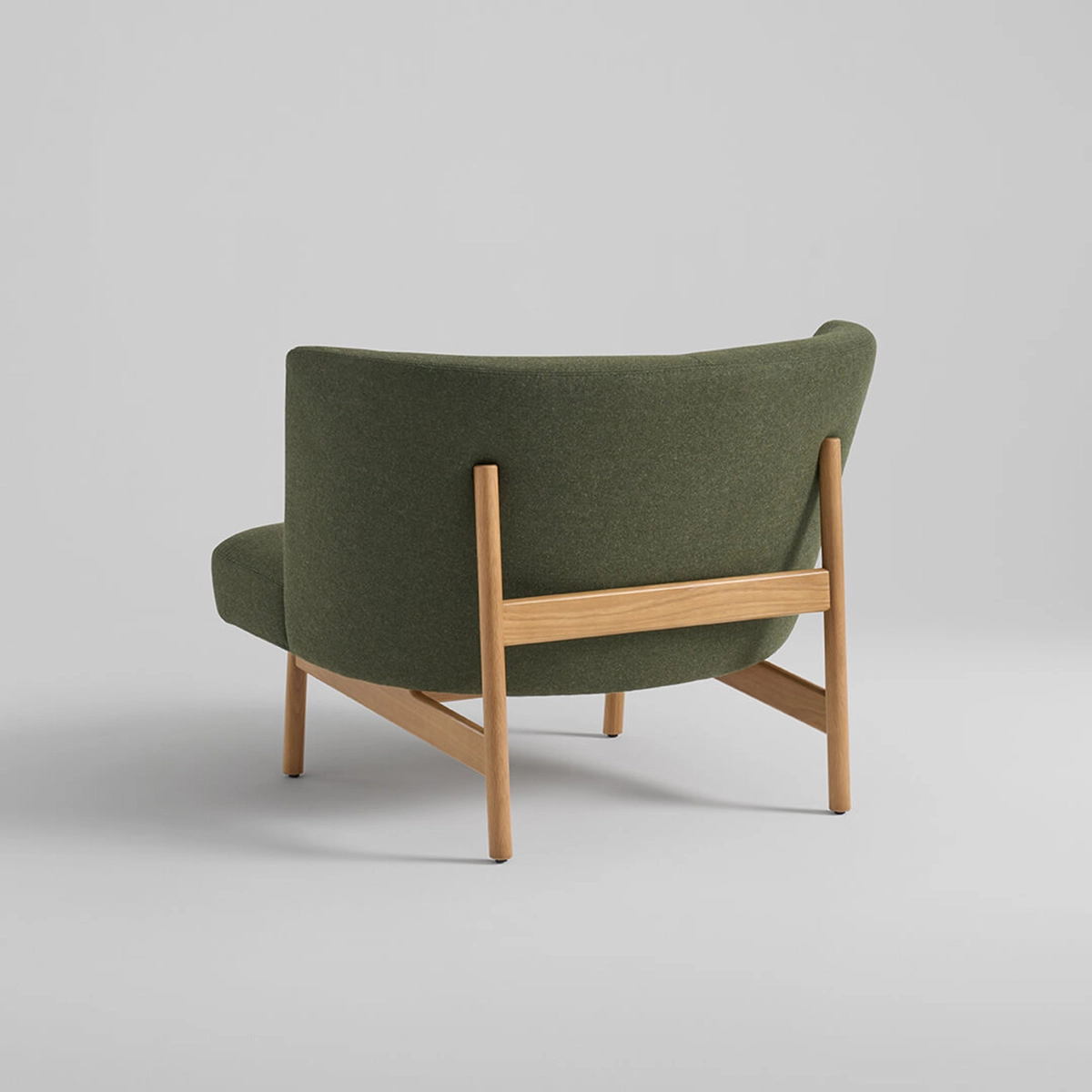 Arcata lounge chair by Anderssen & Voll for Davis showing curved silhouette with exposed oak wood base design
