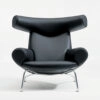 Hans J Wegner Ox Chair black leather Erik Jørgensen production showcasing sculptural design aesthetic