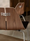 Poul Kjaerholm PK23 lounge chair in natural finish showcasing democratic design approach and accessibility