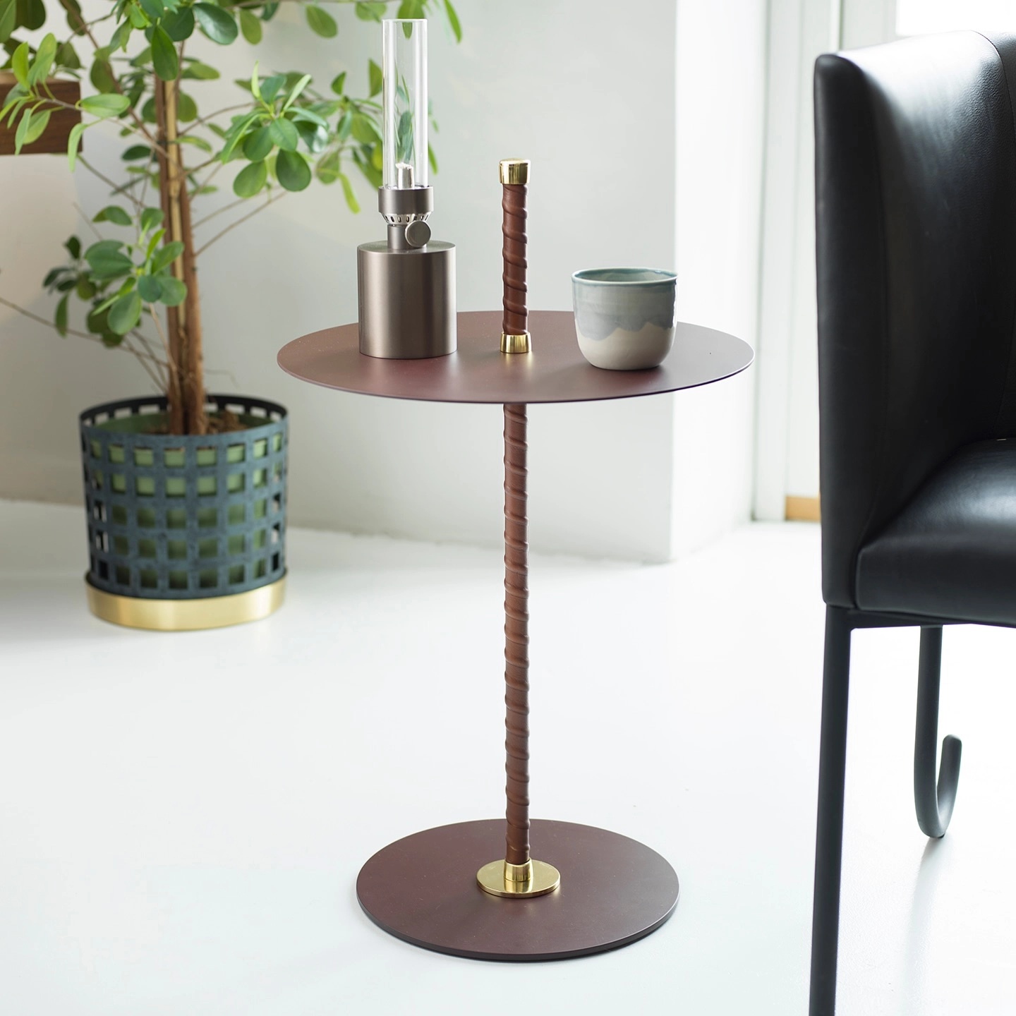 Cabaret side table by Peter Andersson for Klong with leather-wrapped pillar and brass details in black finish