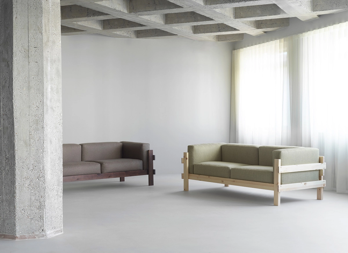 Kube 3-seater sofa by Simon Legald showing pine frame with plush cushions in living room setting