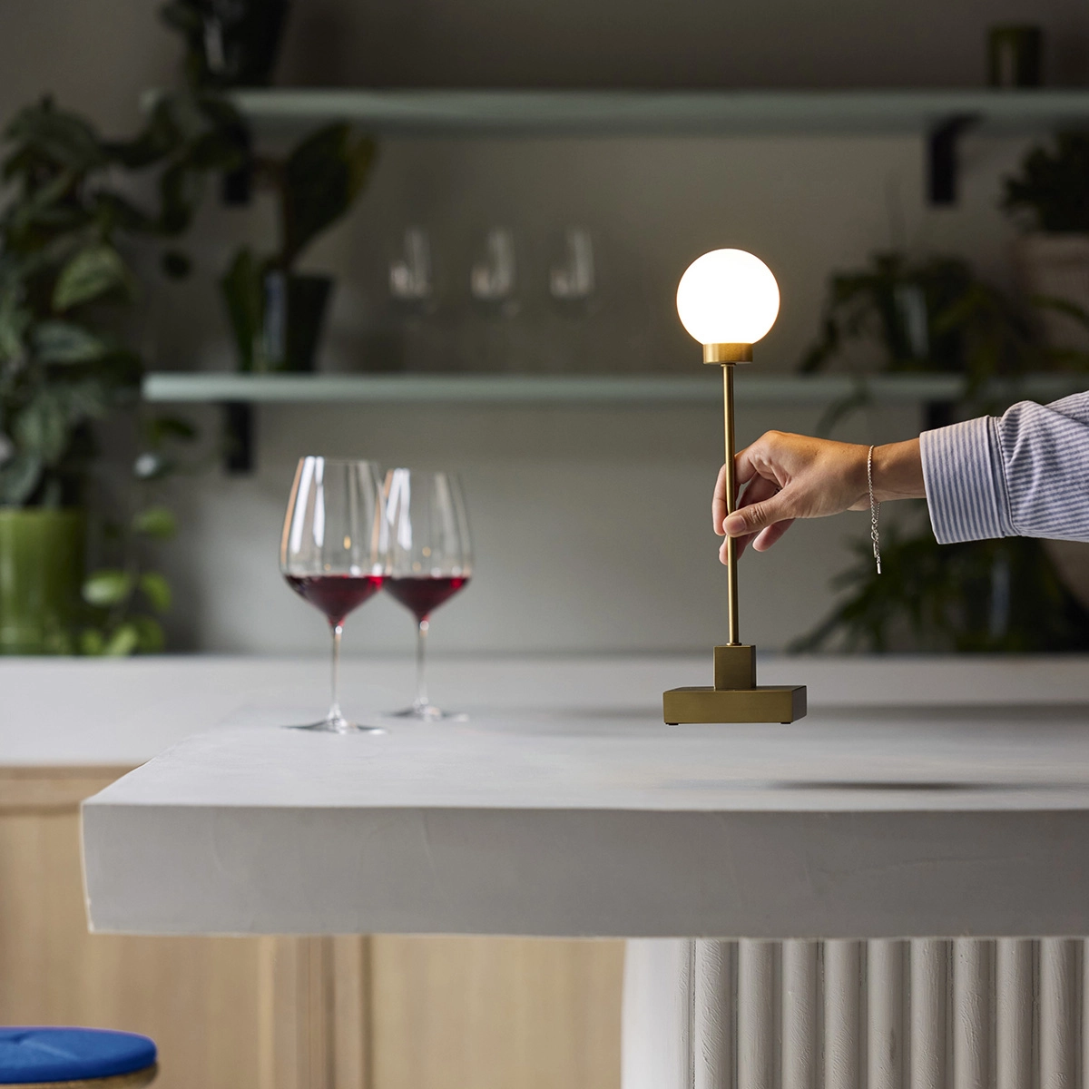 Northern Snowball Portable table and floor lamp collection by Trond Svendgård featuring brass and grey finishes