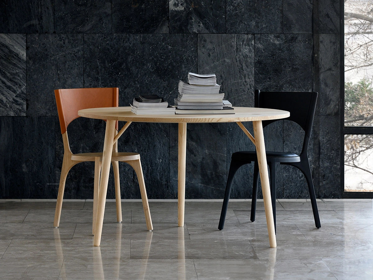 Branchmark Table hand-carved narwhal tusk inspired leg detail Zanat traditional craftsmanship Swedish architectural design