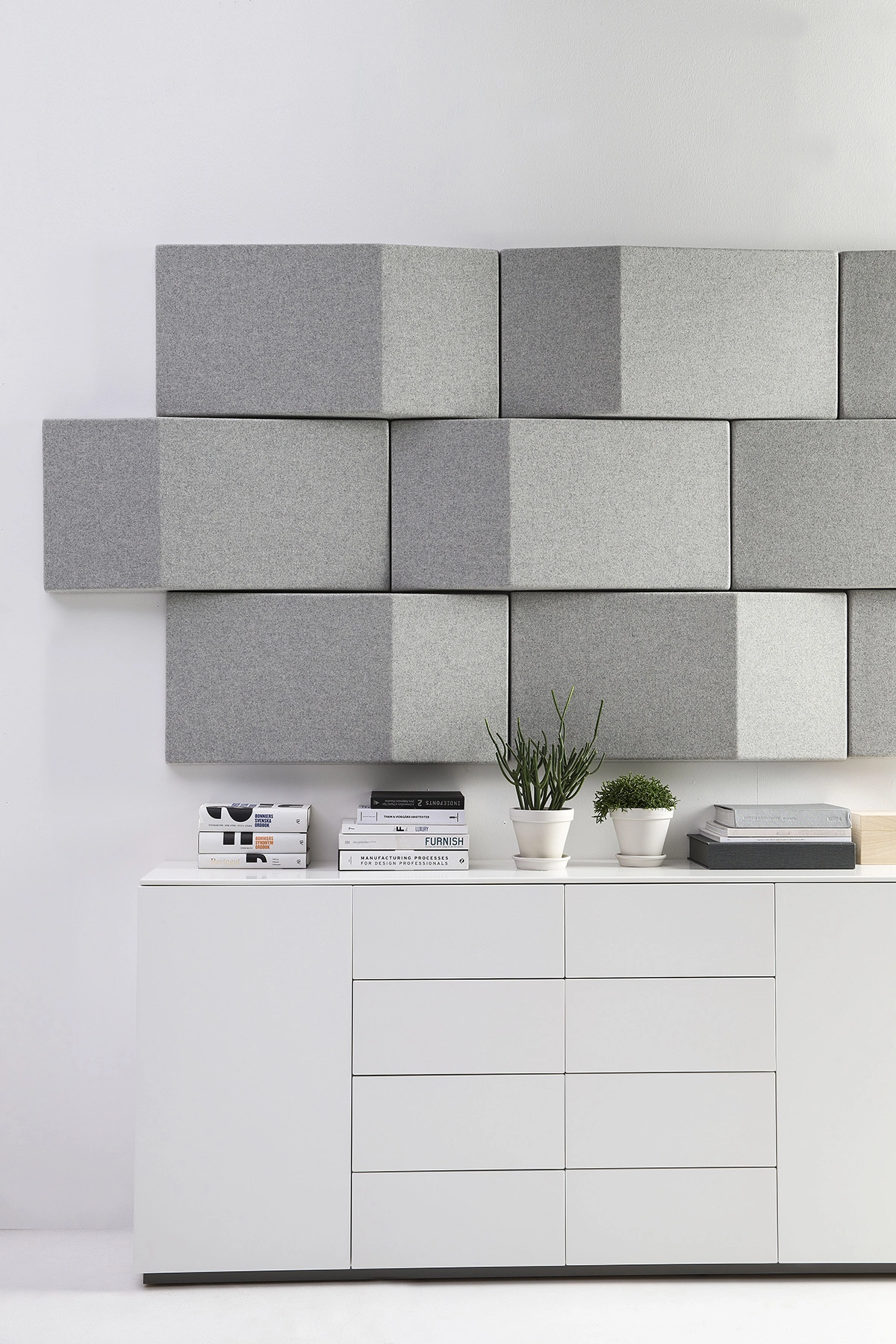 Triline wall panels by Anya Sebton for Abstracta showing triangular acoustic design in modern office setting