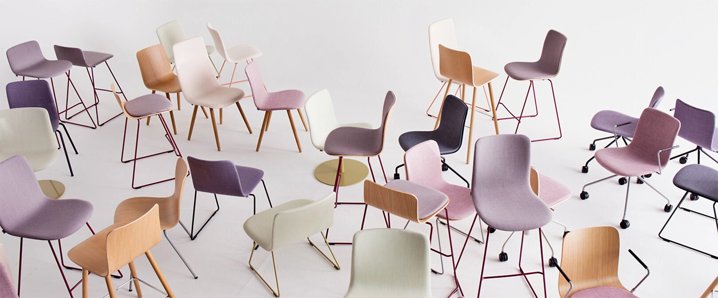 Martela designs flexible Finnish workplace furniture focusing on ergonomics, adaptability, and sustainable circular economy principles.