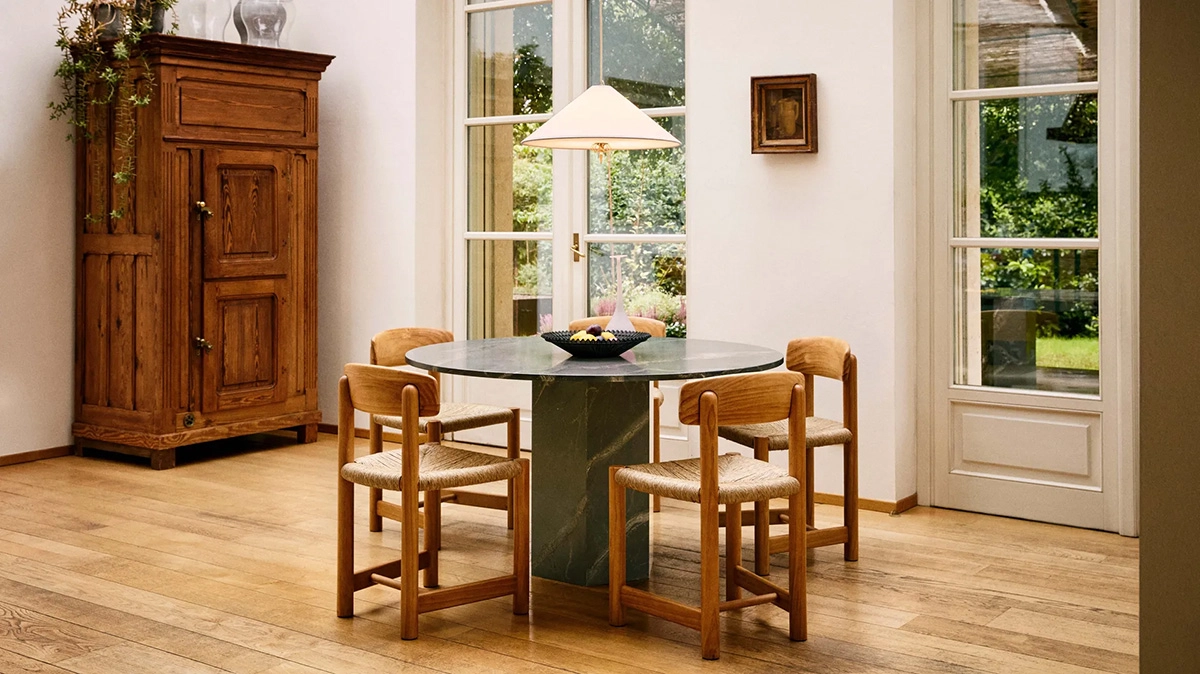 Daumiller Armchair and Side Chair collection by GUBI, showcasing both golden pine and brown/black-stained finish options.