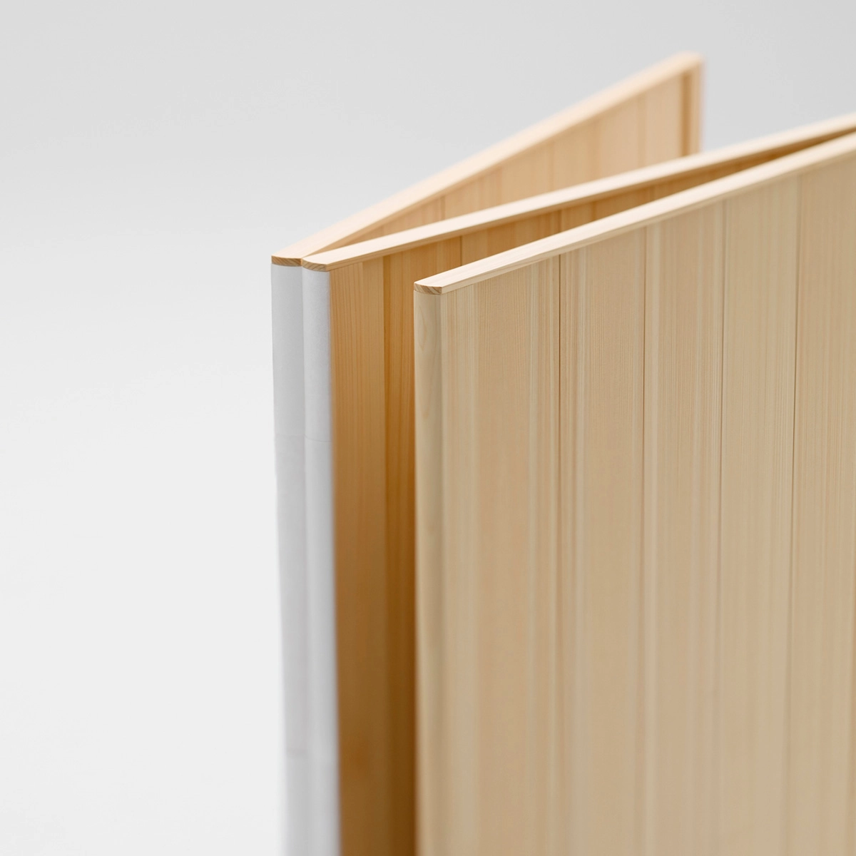 Side profile of Maku screen displaying its slim silhouette and precise proportions in the wooden version.