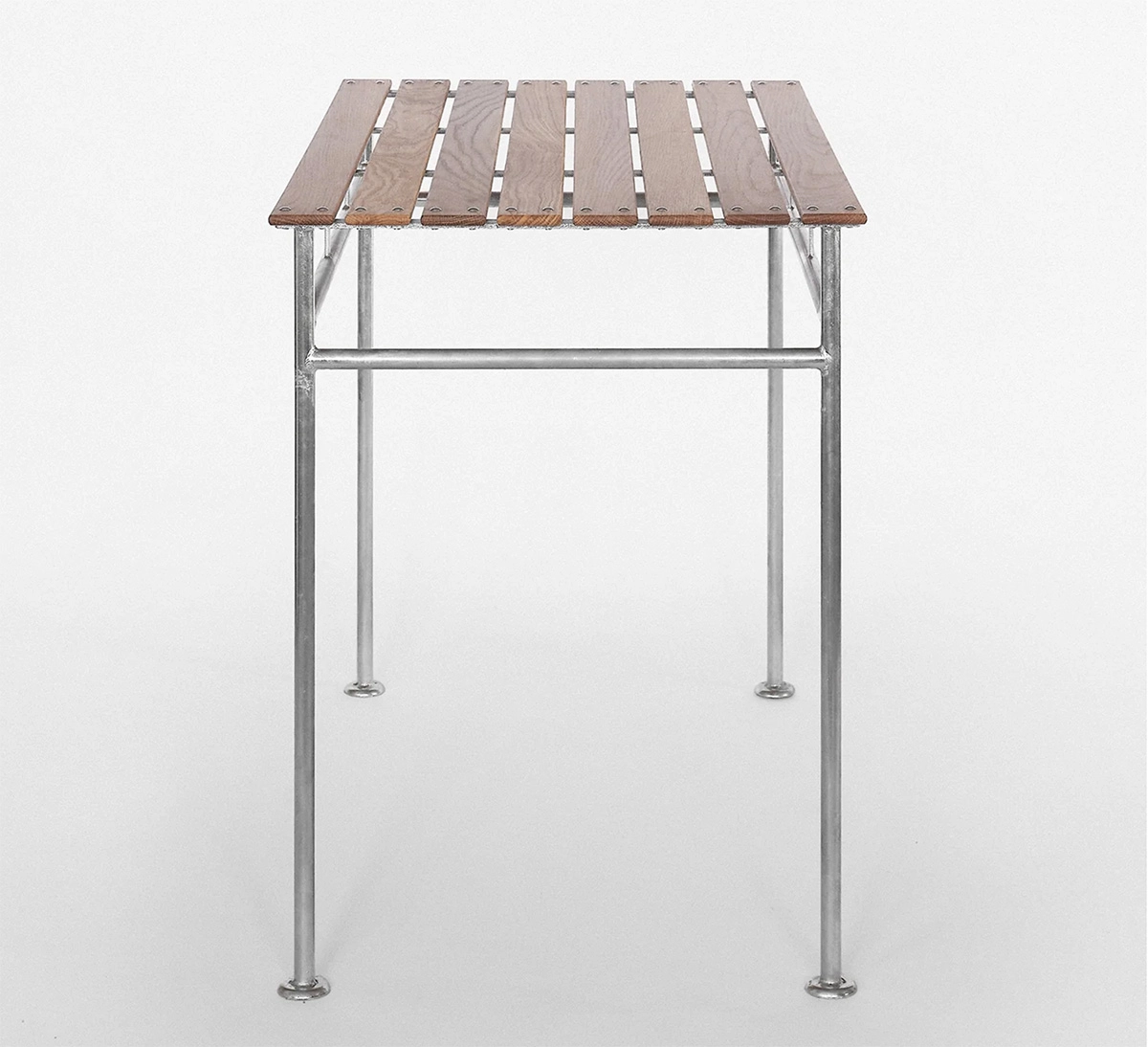 Modernist Stockholm Table with galvanized steel frame and natural wood top, designed for outdoor spaces