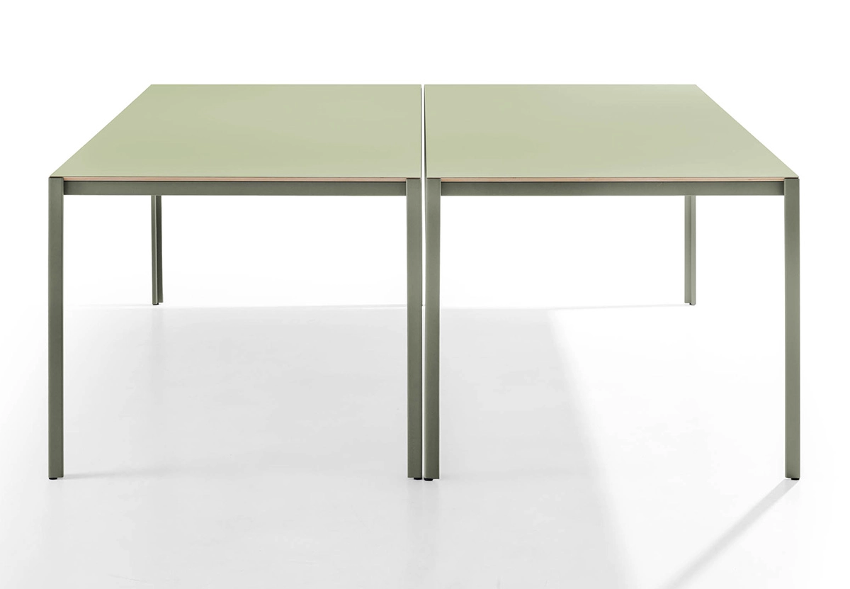 Architectural detail of Sarek's L-shaped metal leg design showcasing the elegant overlap with tabletop