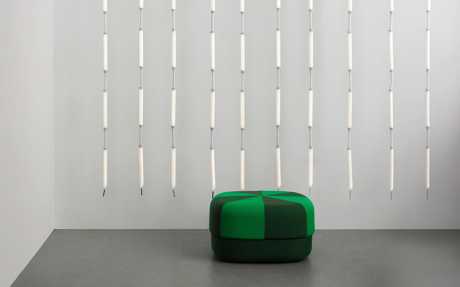 Verena Hennig's Reb Lamp for Normann Copenhagen featuring multiple illuminated modules in mesh fabric arranged as pendant lighting.