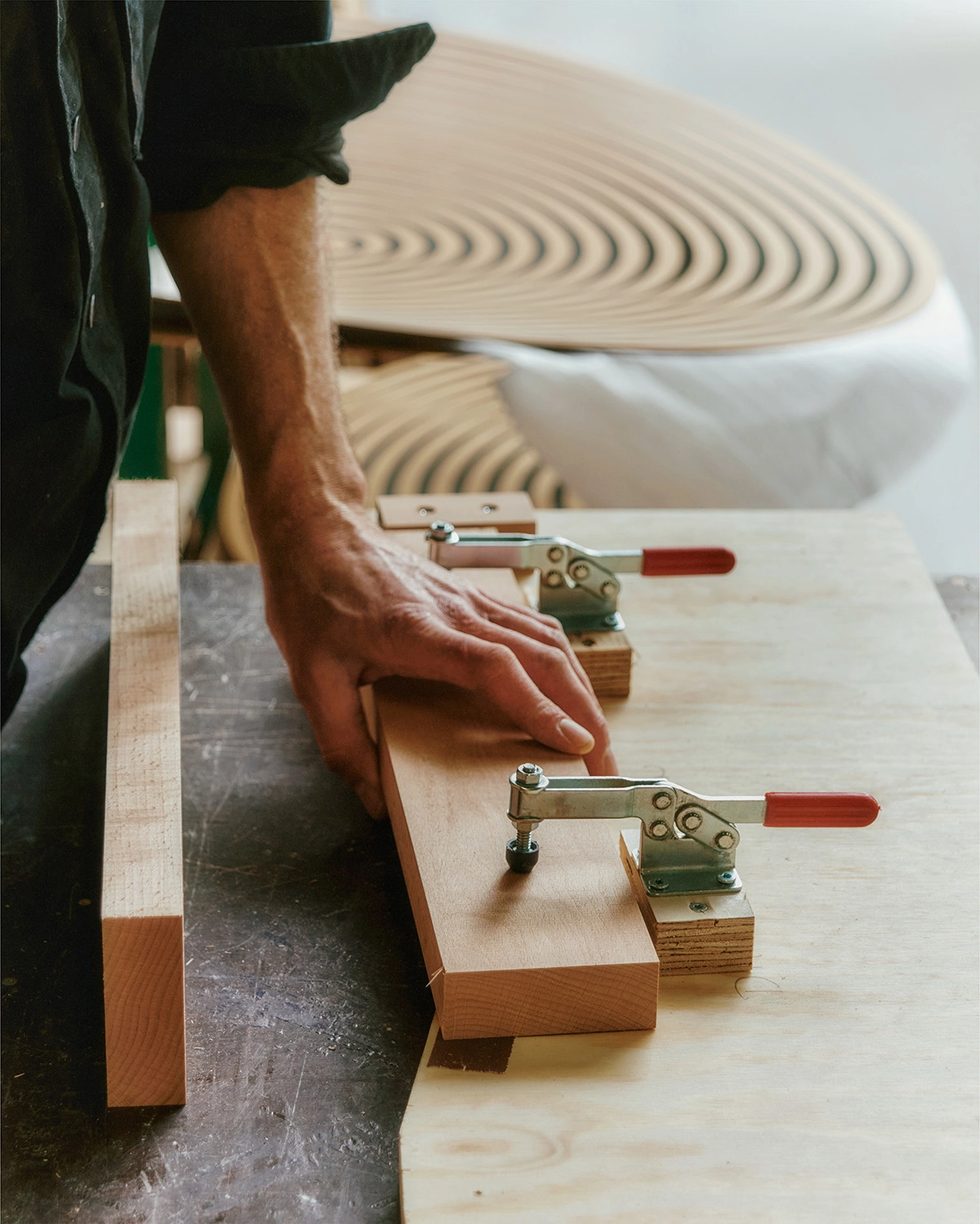 Danish workshop craftsmen assembling Nanna Ditzel bench using traditional woodworking techniques