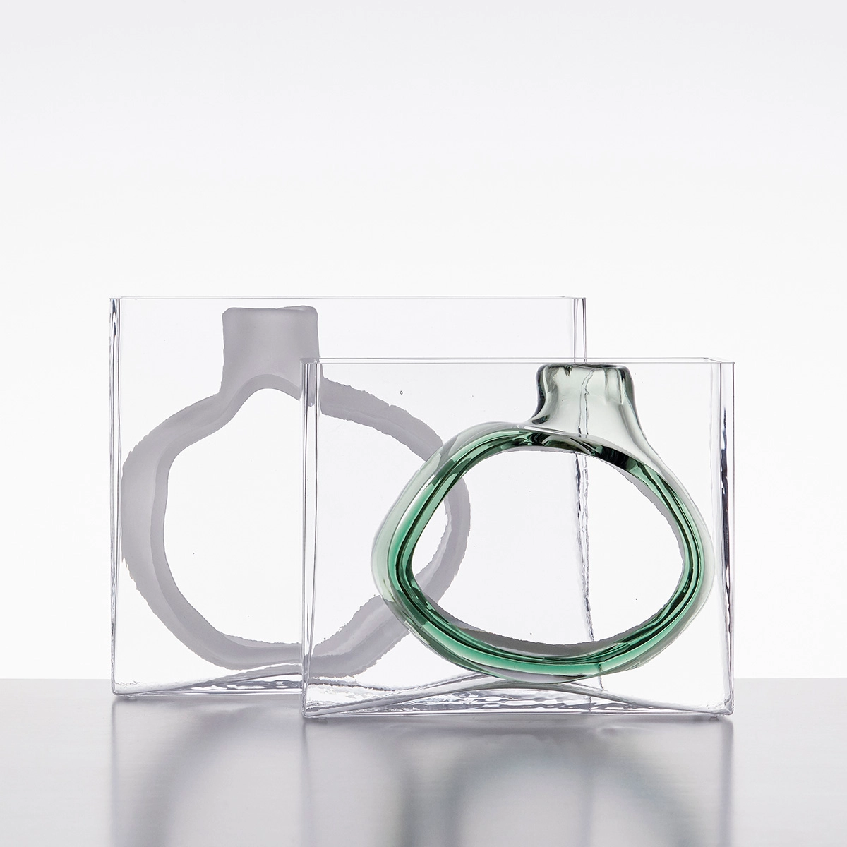 Swedish glass designer Matti Klenell portrait with his contemporary glass sculptures from 9 Factory Road series