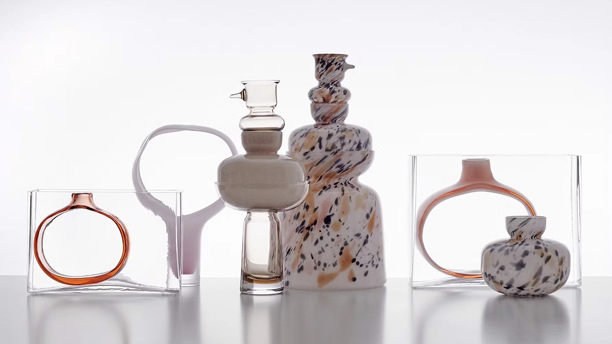 Multiple glass sculptures by Matti Klenell displayed in gallery setting showing varied forms and transparency