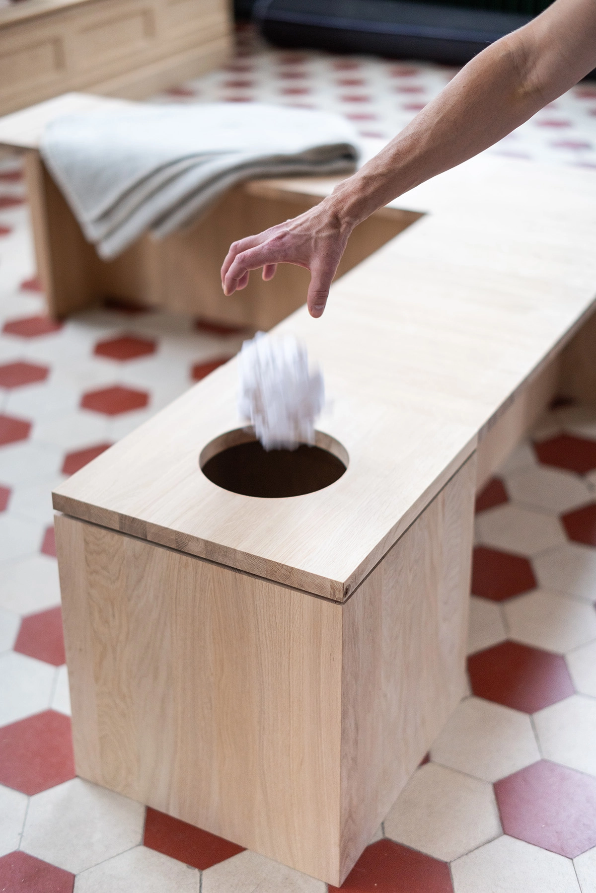 V.TB.01 seating collection arranged in public space showing modular configuration options and oak finish