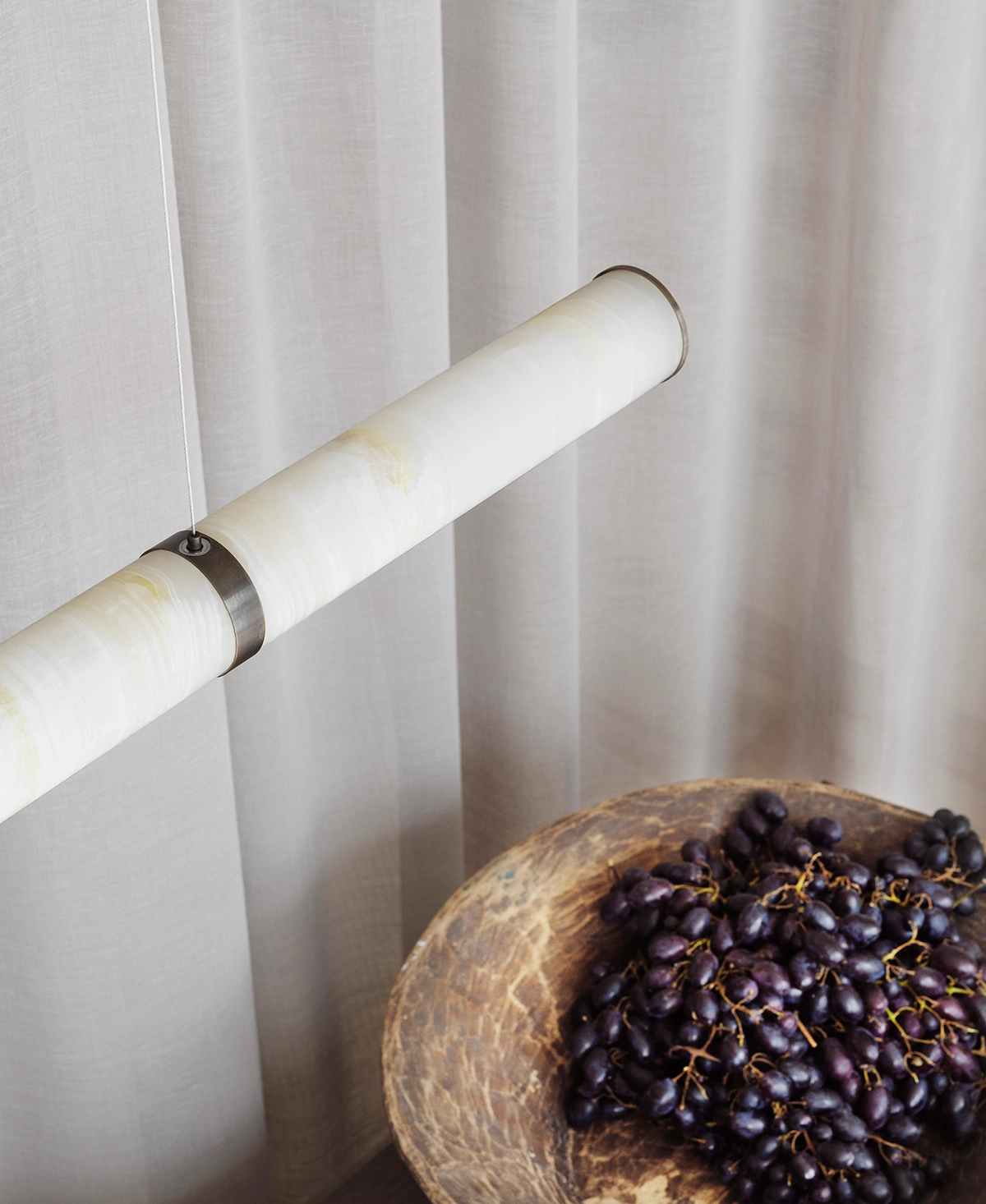 Close-up detail of natural onyx texture in PARS Collection showing stone's translucent qualities