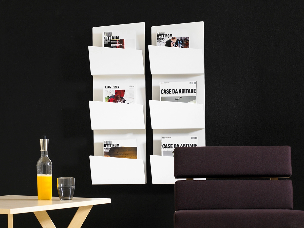 Collar magazine storage system wall mounting with metal rail showing Swedish engineering precision details