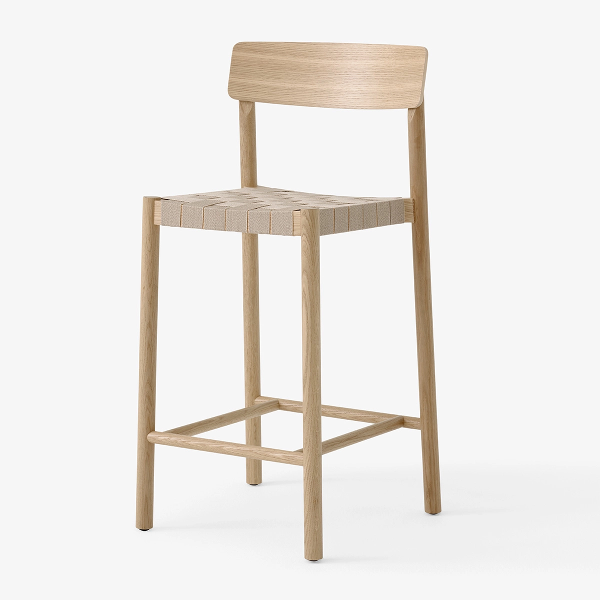 Side profile Betty counter chair displaying ergonomic backrest and elevated seating design