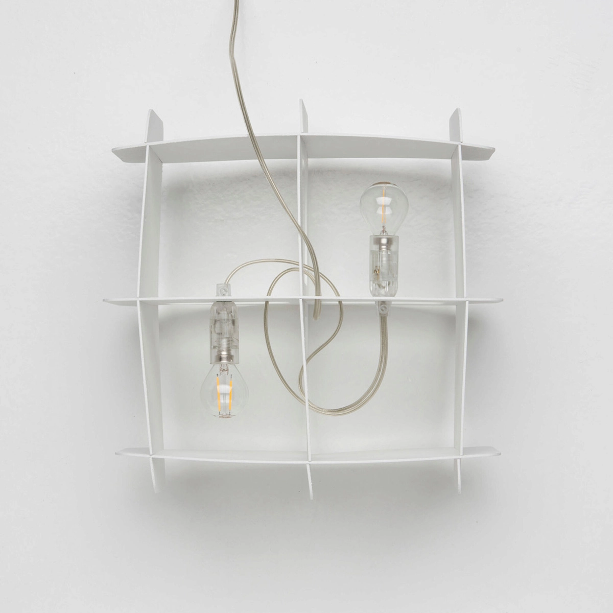 Ristikko pendant lamp isolated showing geometric birch plywood lattice design and warm lighting